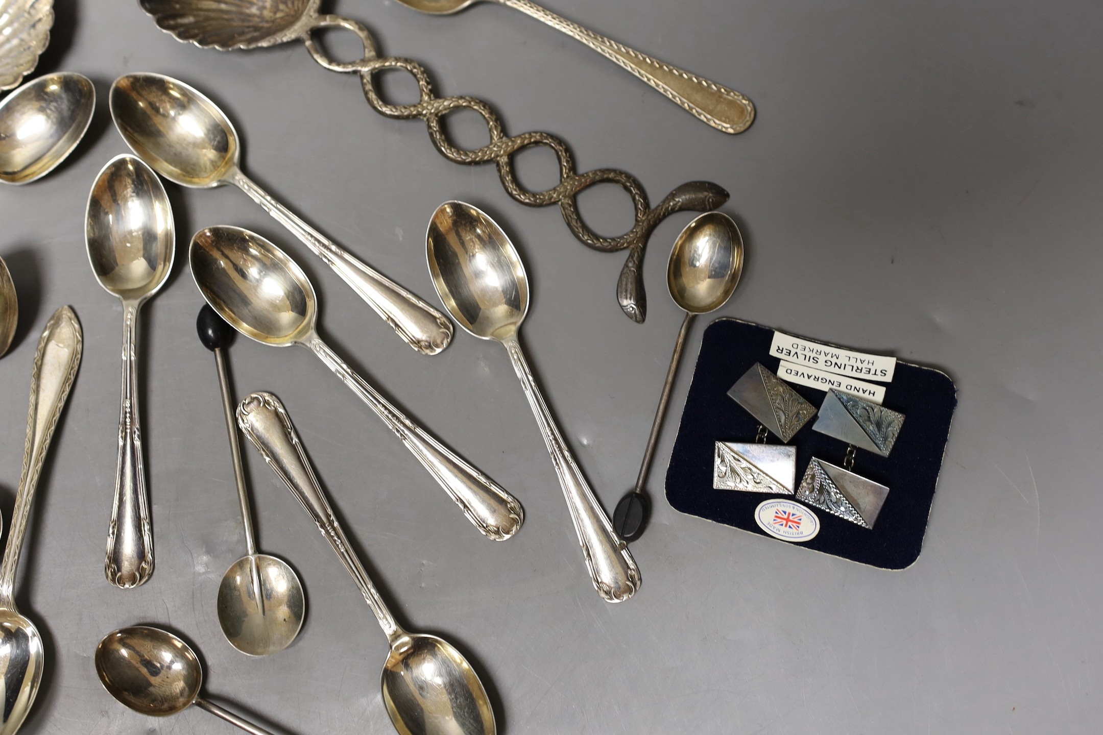 A small group of sundry flatware including a set of six George V silver teaspoons, Sheffield, 1923, a set of six silver bean end coffee spoons etc. and a pair of white metal shell bowl spoons.